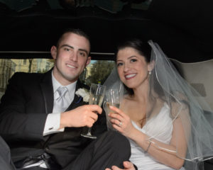 Bride and groom toasting in the Limo on the way to the Marina District in San Francisco