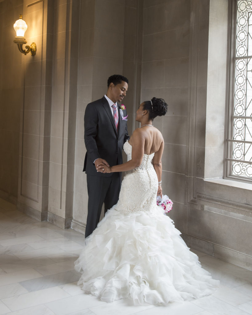 Elegant pose at SF City Hall done by a professional wedding photographer