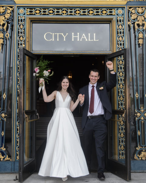 Newlyweds leaving SF City Hall Happy