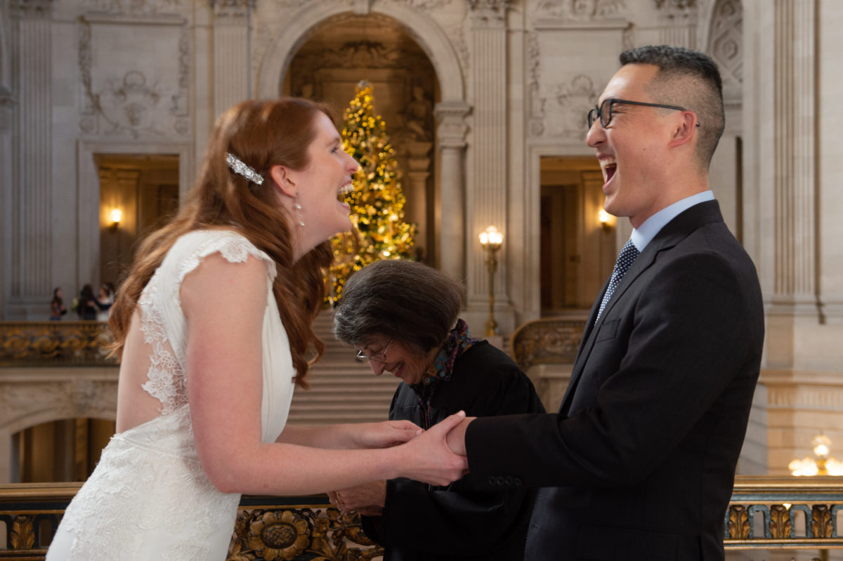 Having fun during their civil ceremony at SF city hall