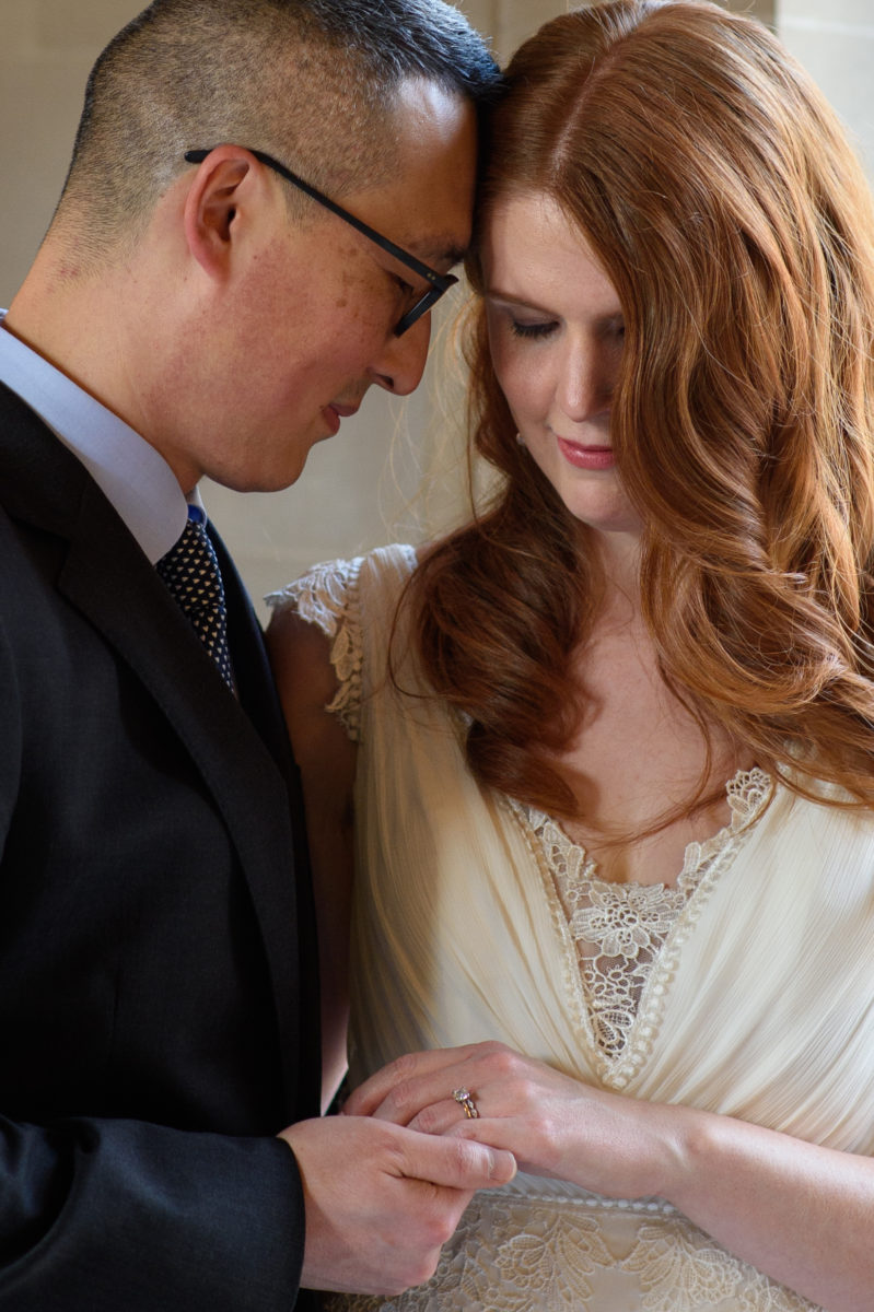 Romantic shot of the bride and groom with her ring