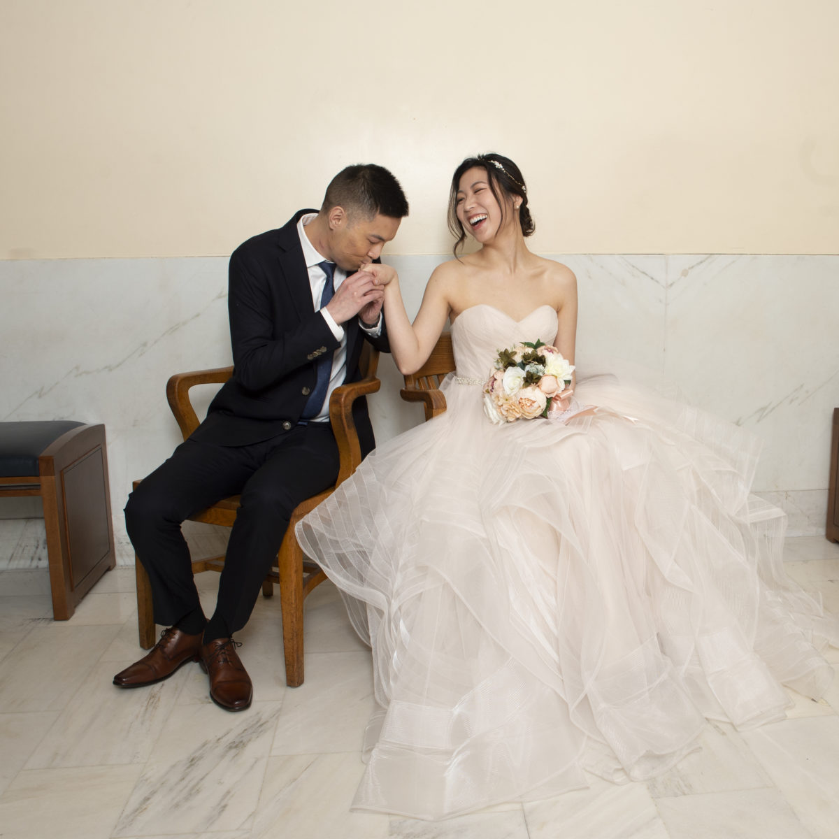 Bride and Groom waiting at the County Clerks office at city hall