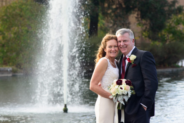 Wedding photography with fountain and trees in the background in San Francisco, California