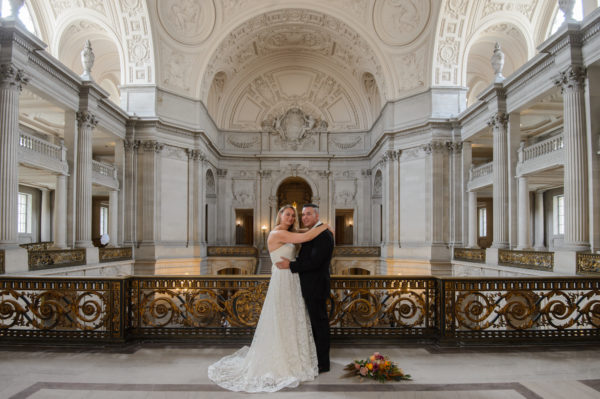 Bouquet on the City Hall Floor with bride and groom