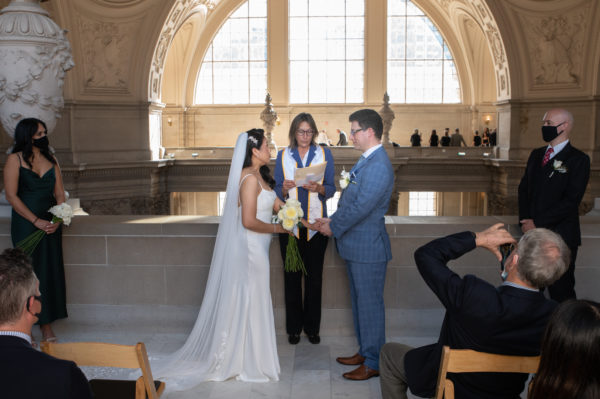 Marriage Ceremony with people on the background at city hall