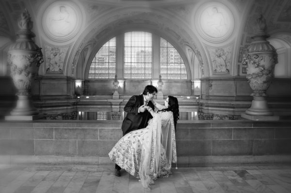 Black and white dip shot of Indian couple.