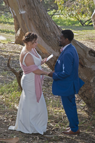 Bride and Groom saying wedding vows in the woods