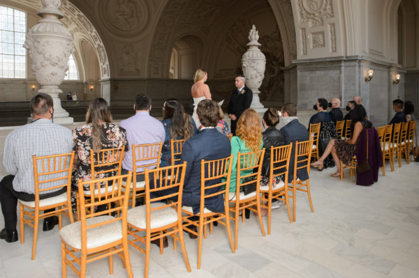 Guests watching San Francisco city hall wedding ceremony at a reserved ceremony