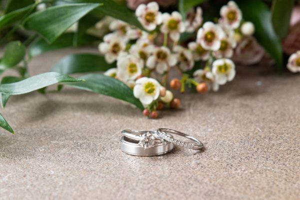 Wedding ring with flowers in the background