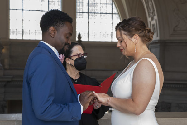 SF City Hall wedding couple exchanging rings on the 4th floor - Wedding Photography