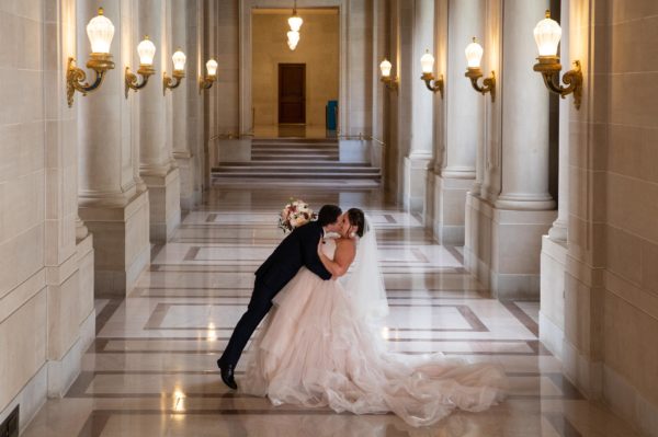 Newlyweds kissing and having fun