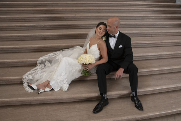 Bride and groom on the Grand Staircase - one of the best photo locations at San Francisco city hall