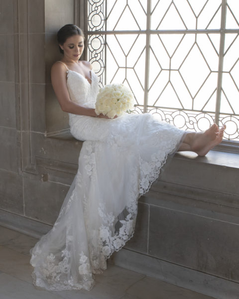 Bride relaxing on the 3rd Floor window City Hall