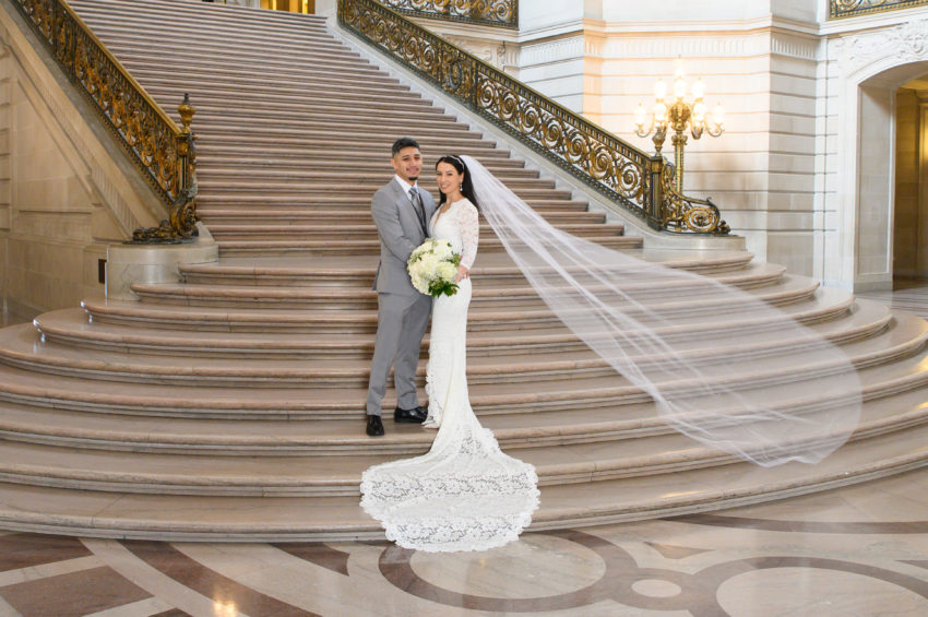 City hall wedding pictures with flowing veil on bride