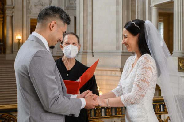 Bride and groom laughing during their City Hall ceremony