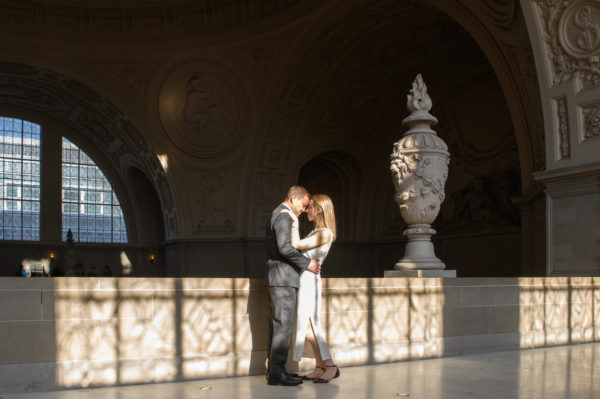 City Hall wedding picture with strangers in the background