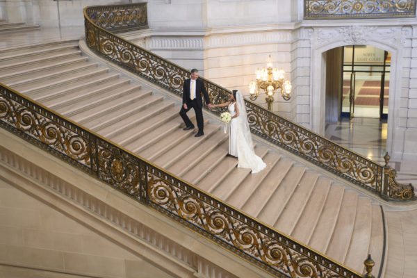 Long wedding dress and veil on the Grand Staircase