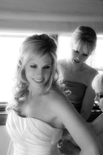 Putting on the wedding dress before a San Francisco city hall marriage