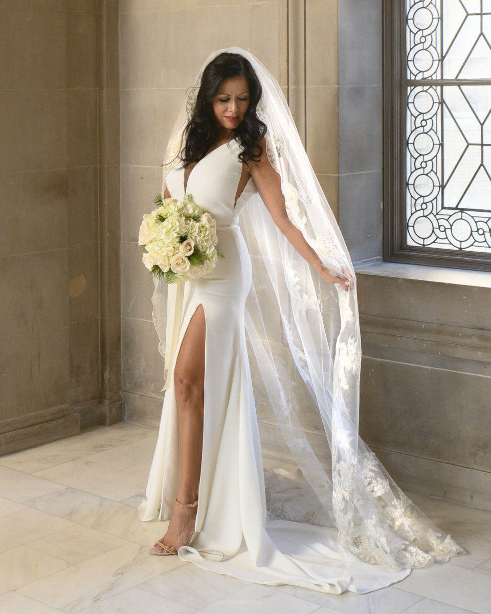 Beautiful bride displays her veil