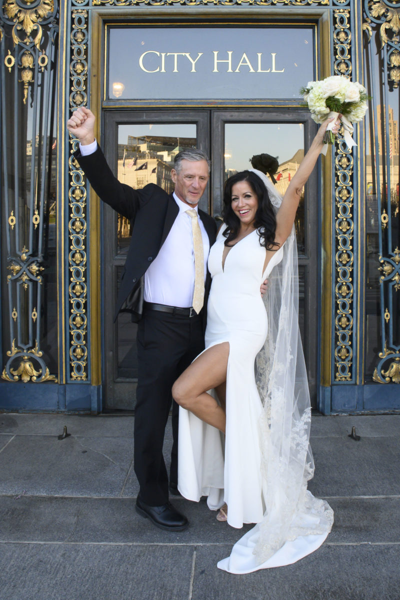 Newlyweds celebrate their recent San Francisco city hall wedding