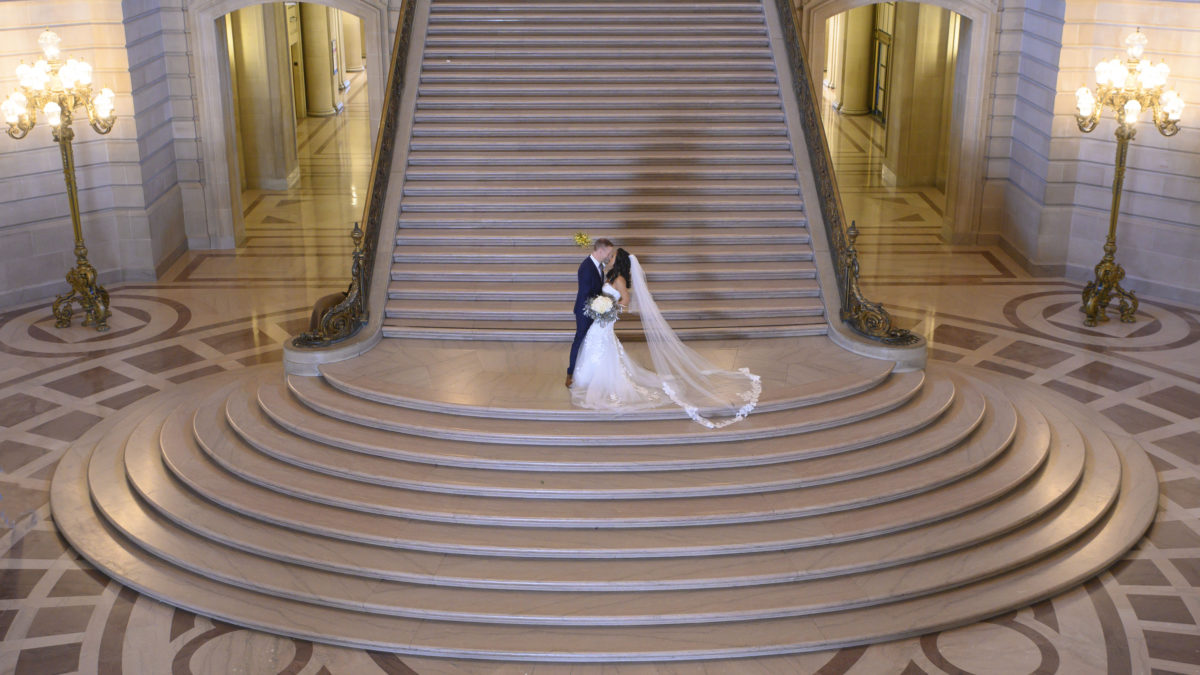 Wedding kiss on the Grand Staircase at San Francisco city hall