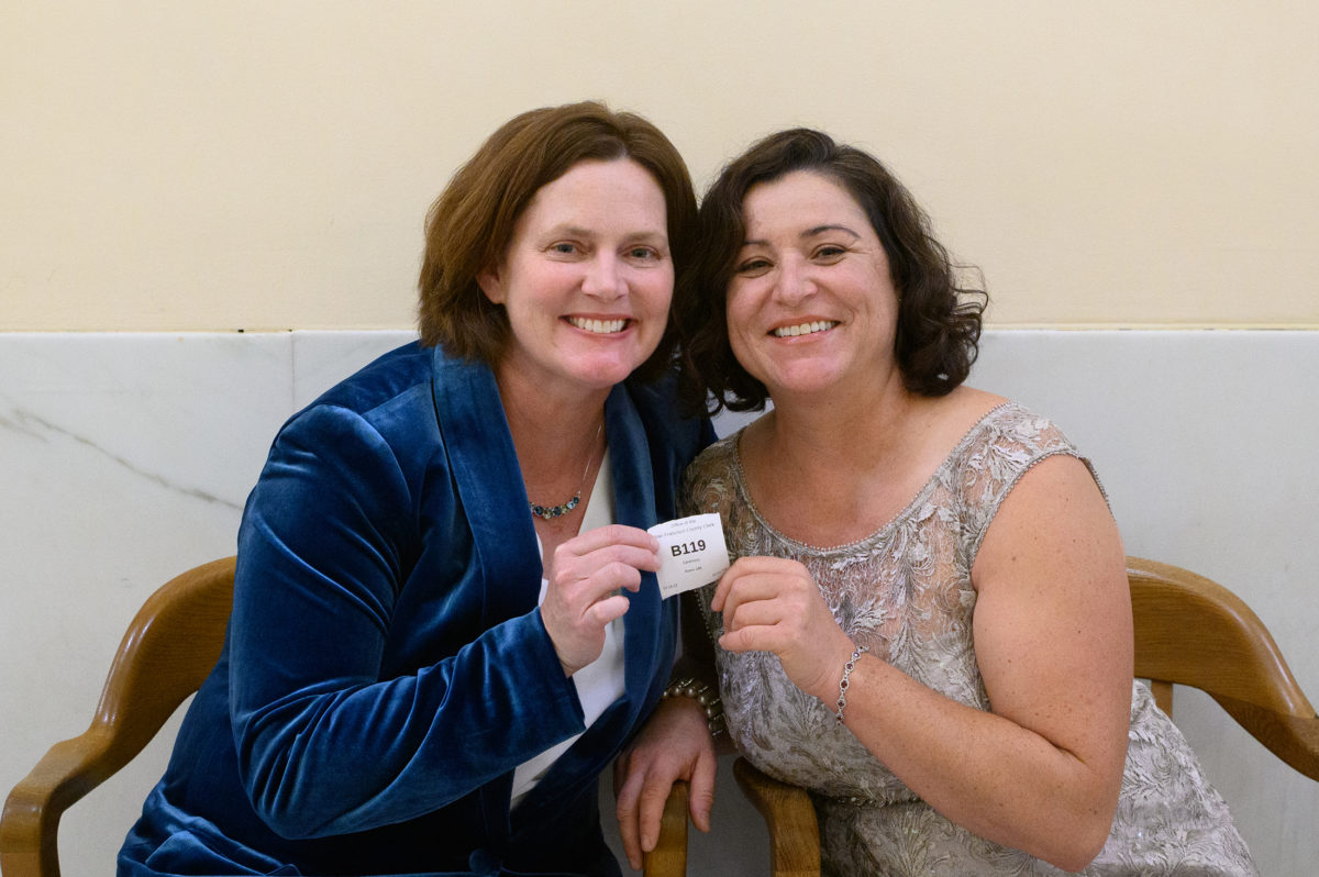 2 brides check-in at San Francisco city hall