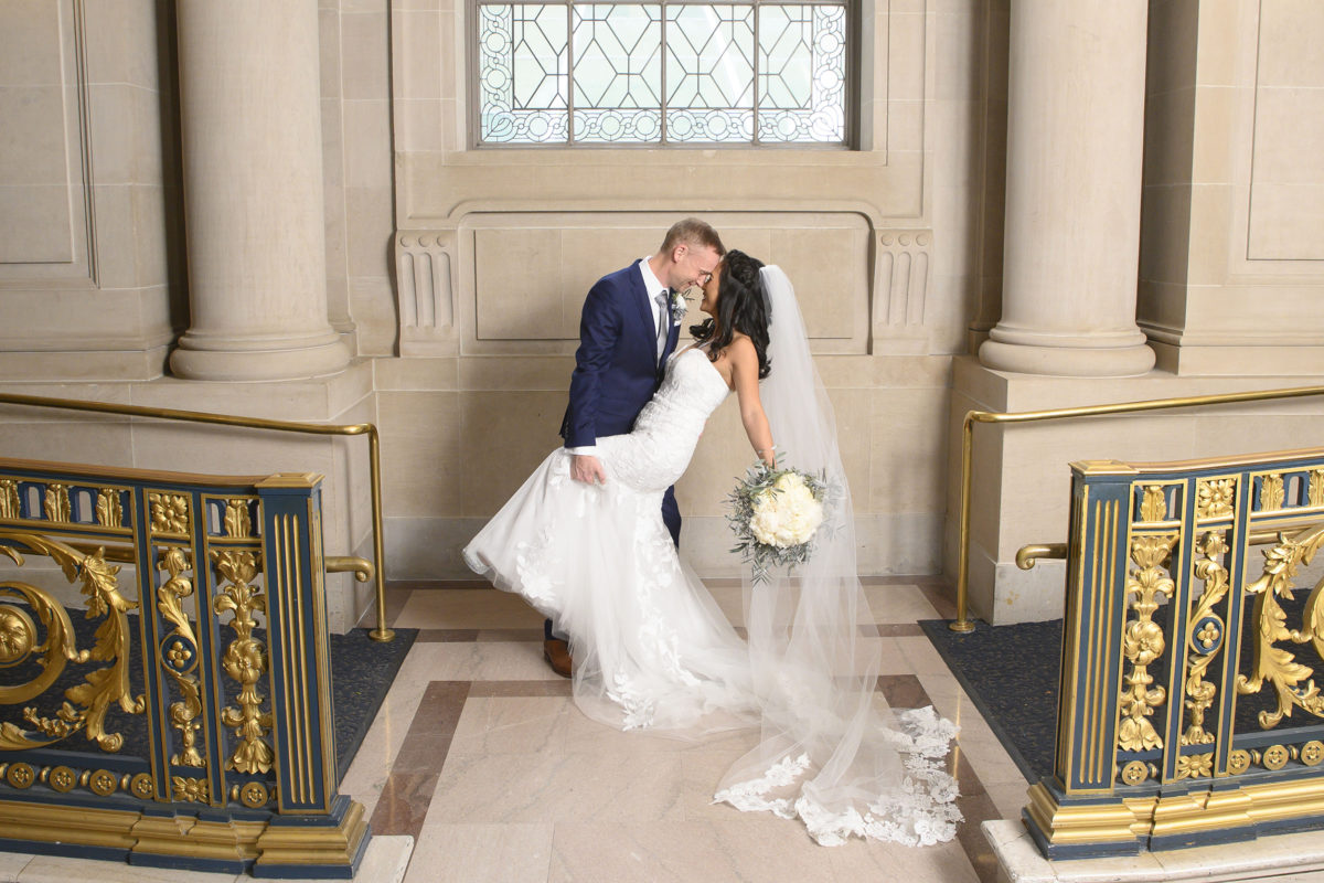 Dance dip with bride and groom at San Francisco city hall