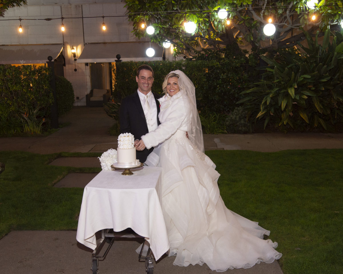 Bride and Groom cutting their wedding cake at the Fairmont Hotel in San Francisco