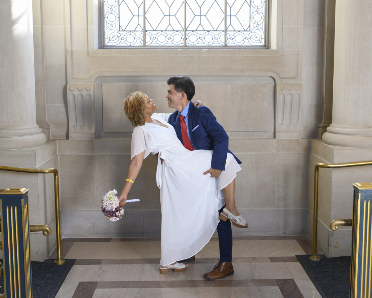 City Hall Newlyweds doing a little dance dip for the camera
