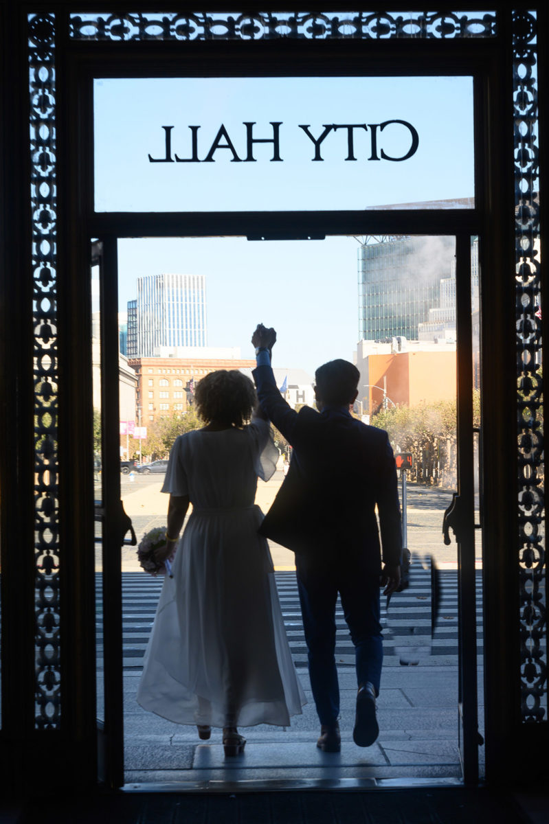 Newlyweds Leaving San Francisco city hall after their ceremony and photo shoot