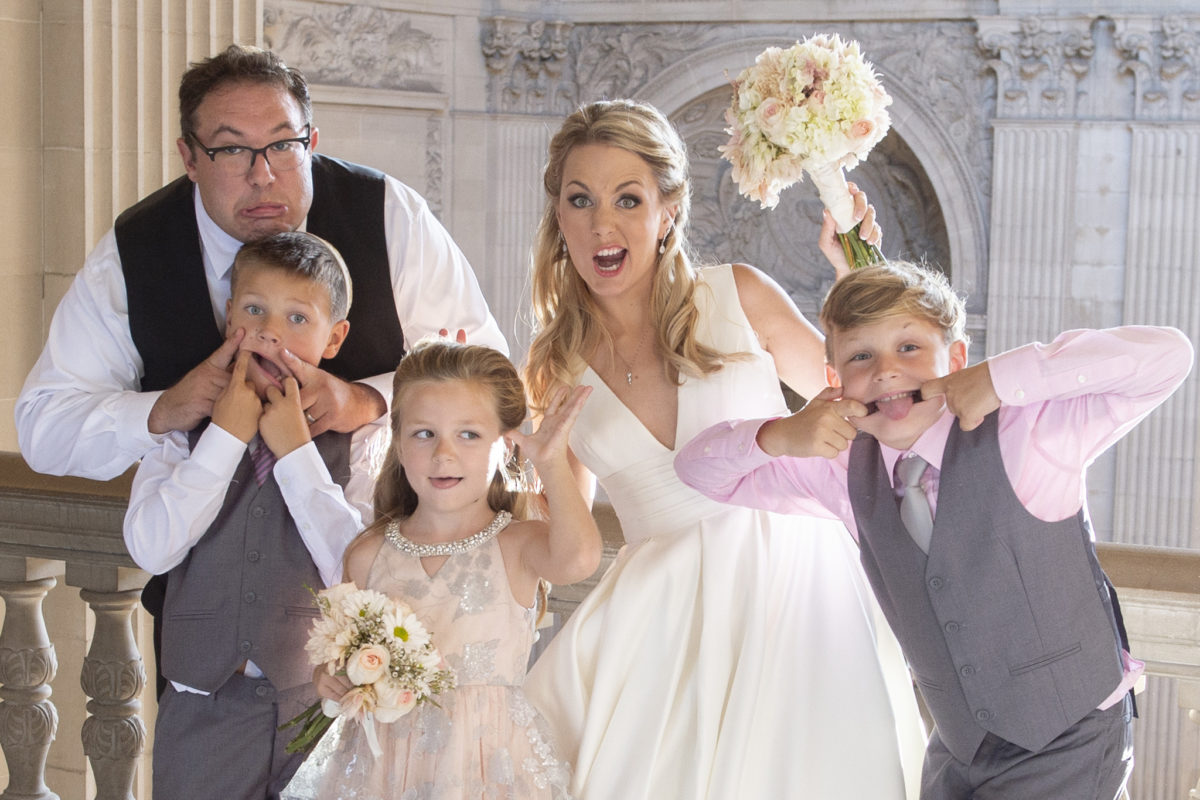 Bride and Groom having fun with their kids at San Francisco city hall wedding