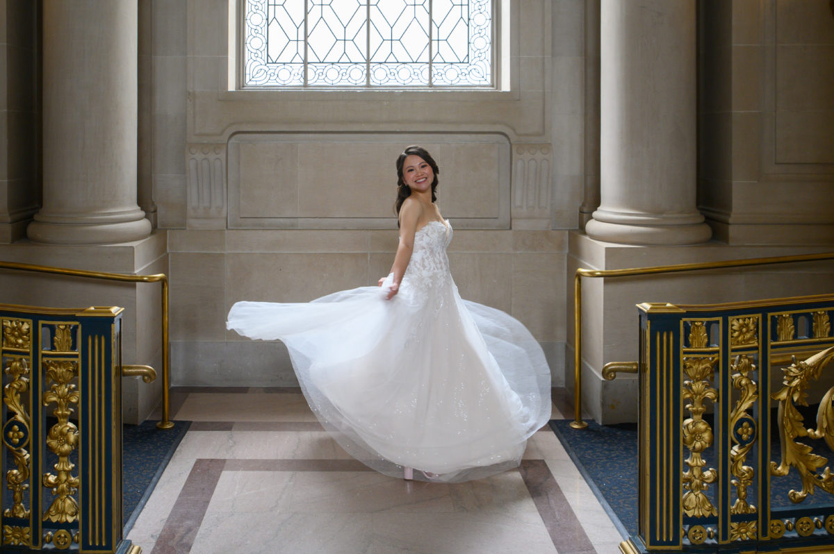 Spinning San Francisco city hall bride after her wedding