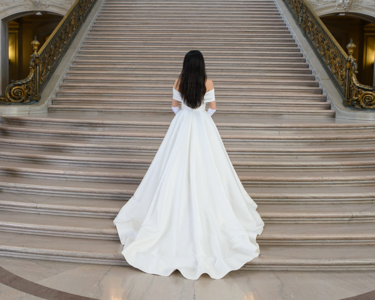 San Francisco city hall bride displaying the back of her wedding dress