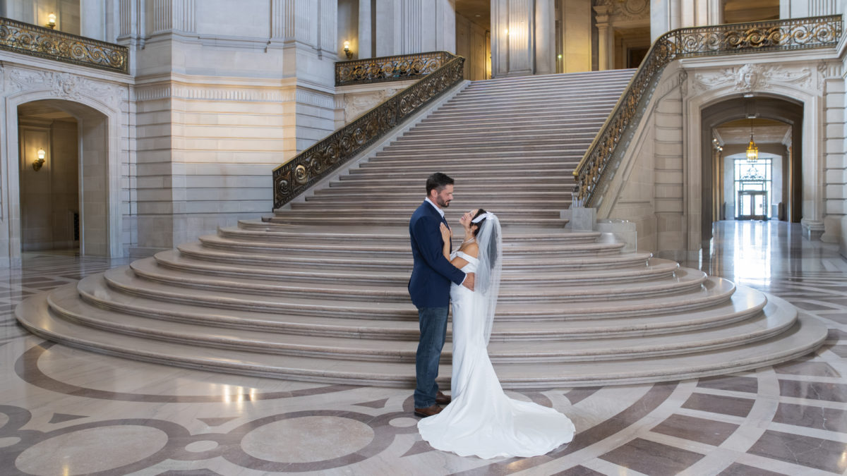 San Francisco city hall wedding photo on the Grand Staircase with bride and groom