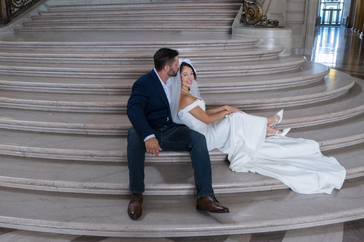 Bride and Groom relaxing the Staircase at city hall