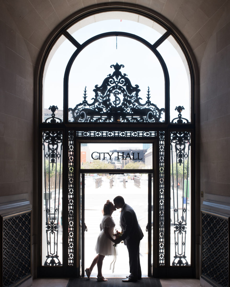 Bride and Groom kissing at San Francisco city hall