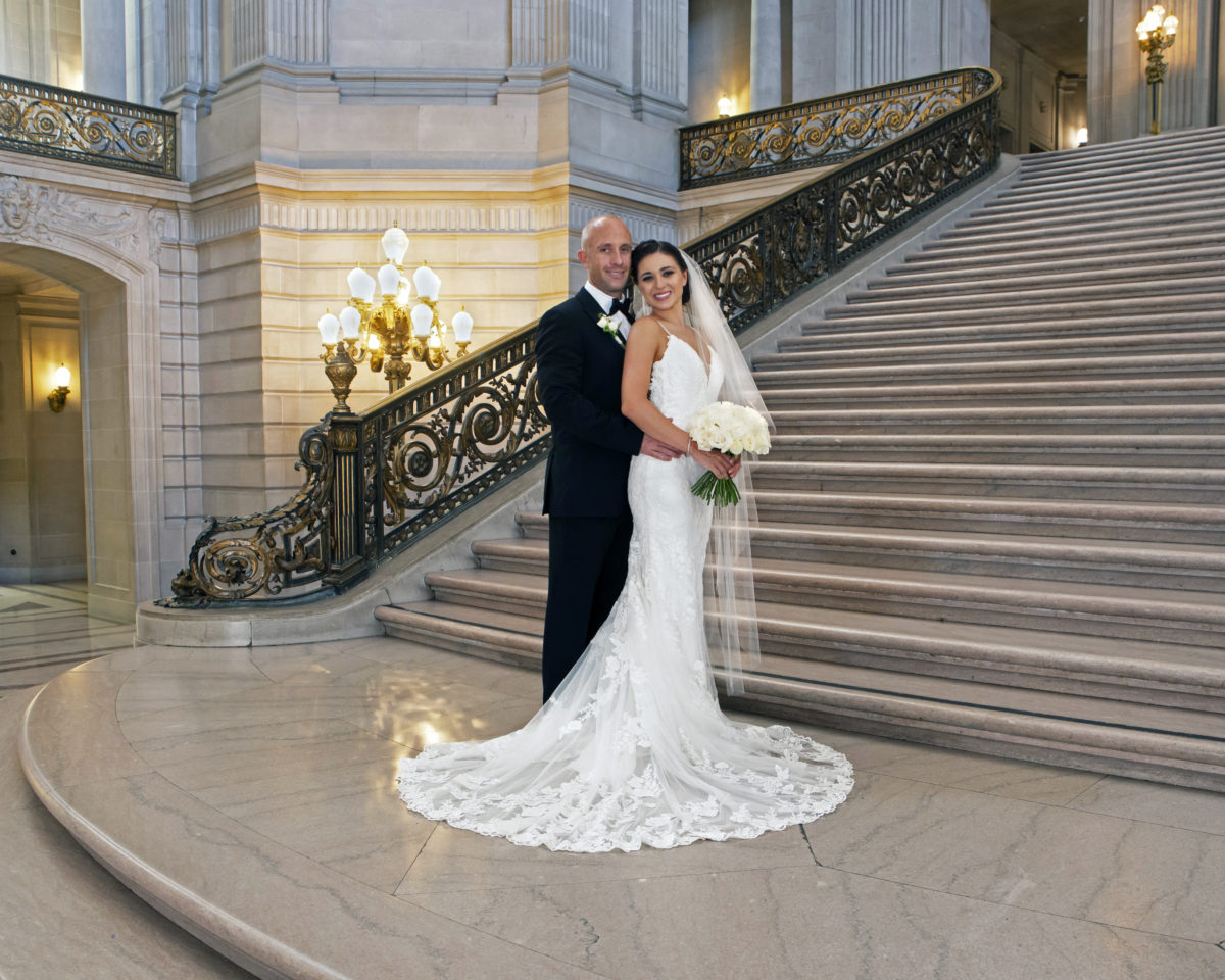 City Hall Bride and Groom posing on the Grand Staircase for their wedding pictures