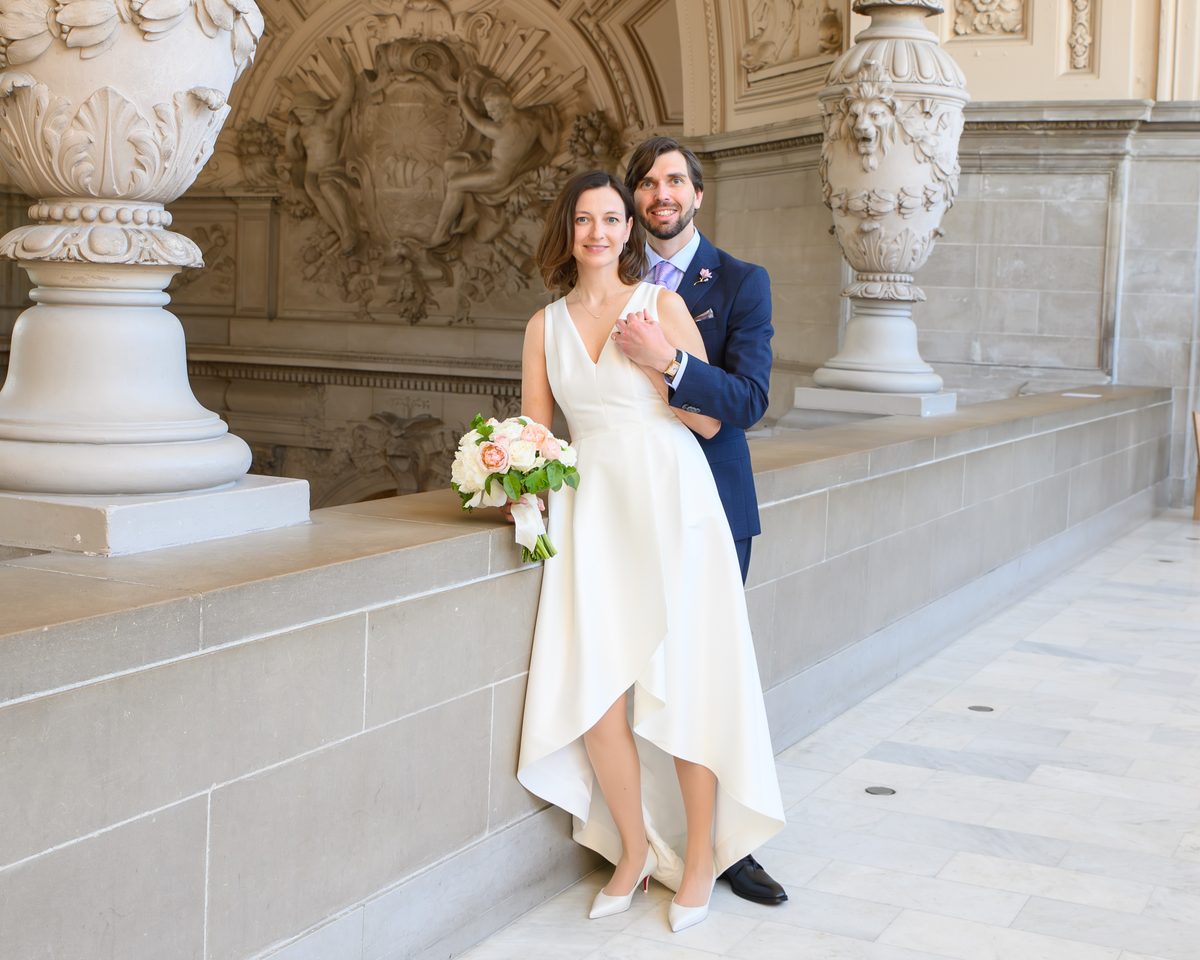 4the floor SF city hall wedding pictures with bride and groom posing